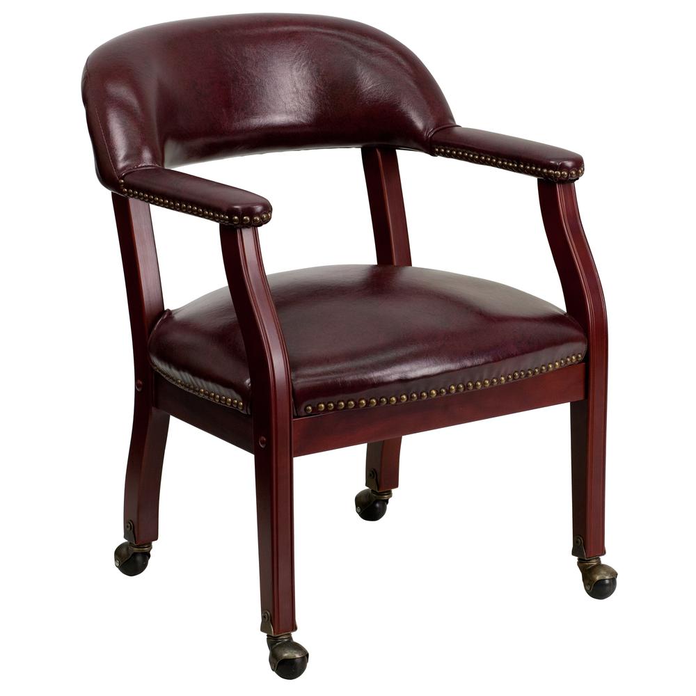 Oxblood Vinyl Luxurious Conference Chair with Accent Nail Trim and Casters. Picture 1