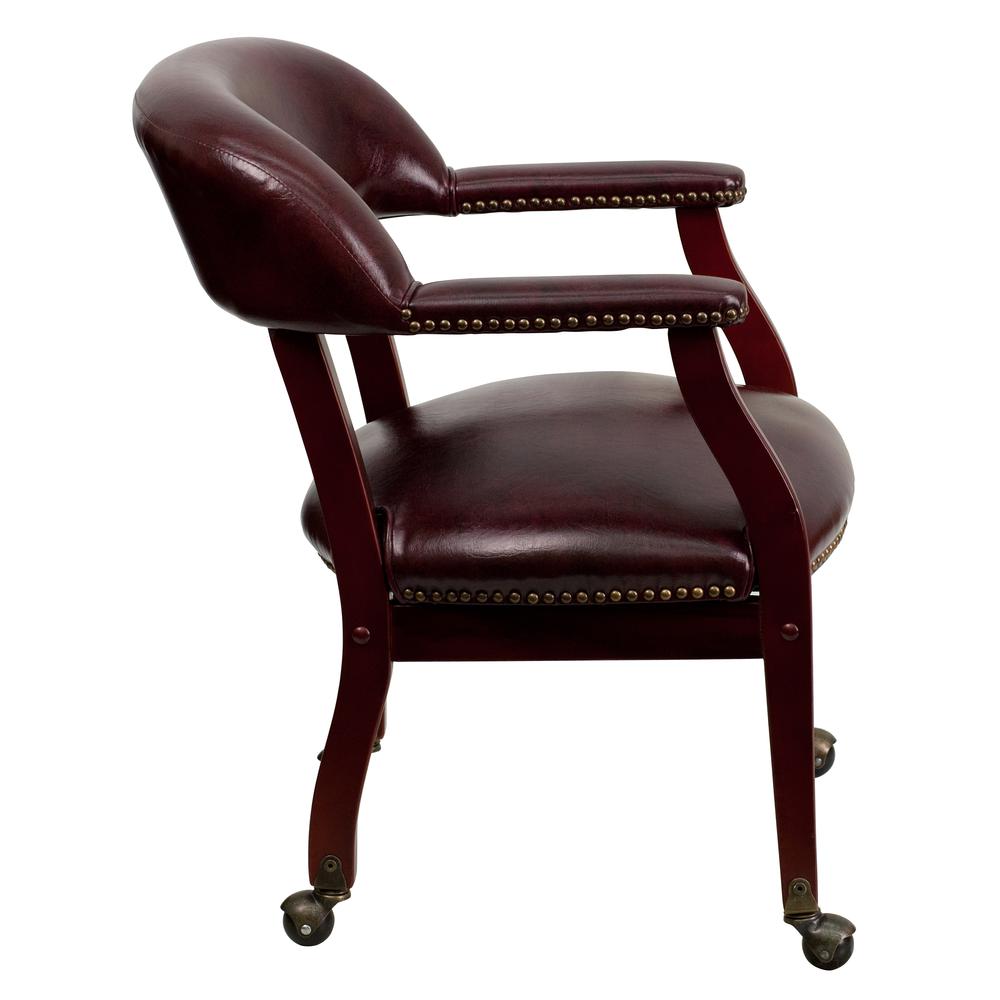 Oxblood Vinyl Luxurious Conference Chair with Accent Nail Trim and Casters. Picture 3