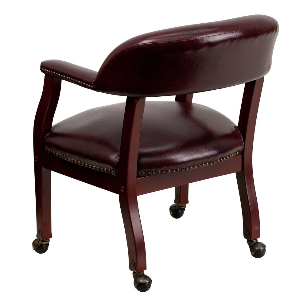 Oxblood Vinyl Luxurious Conference Chair with Accent Nail Trim and Casters. Picture 4