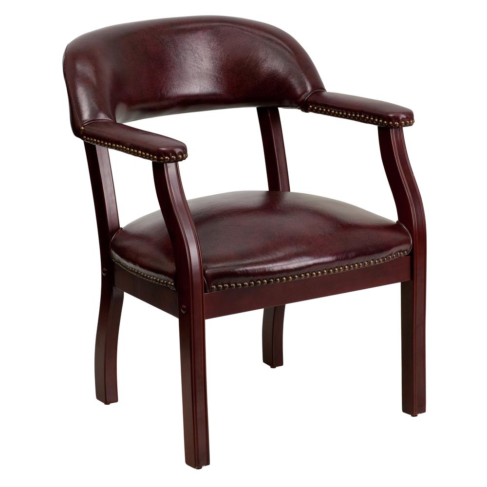 Oxblood Vinyl Luxurious Conference Chair with Accent Nail Trim. Picture 1