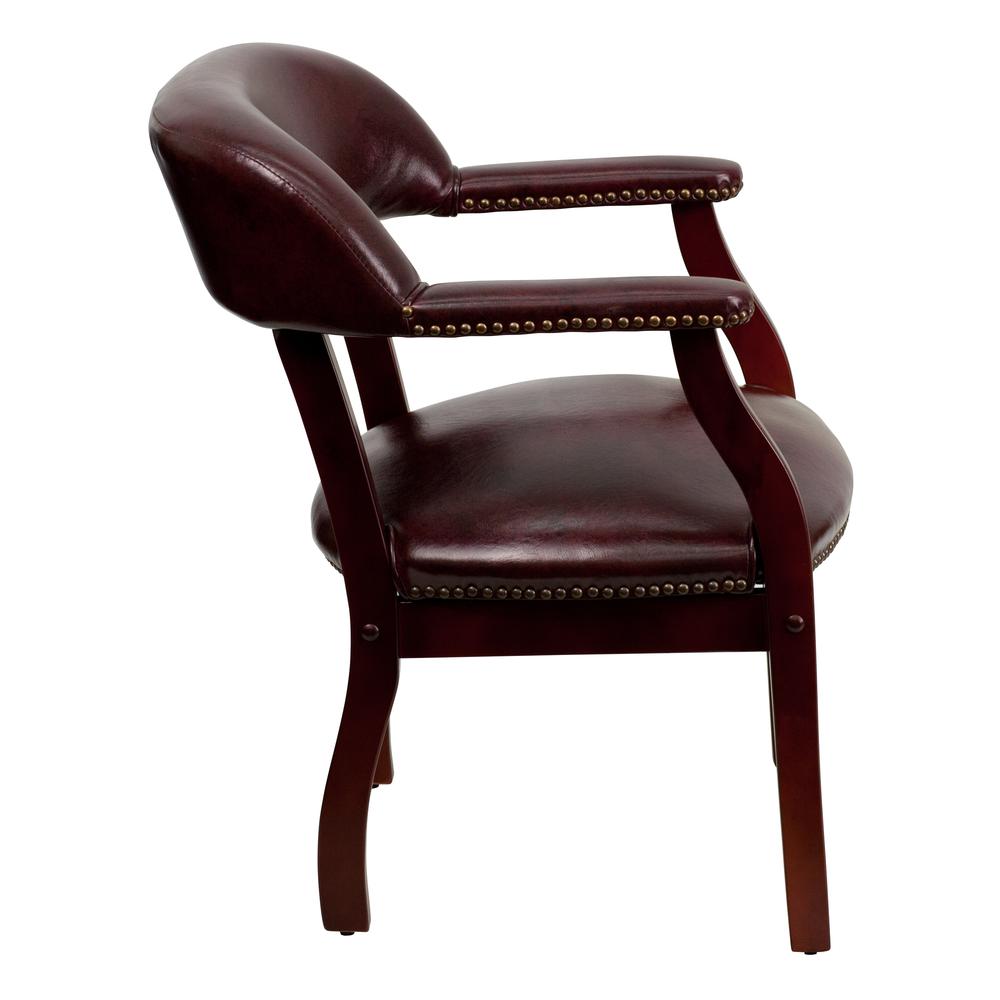 Oxblood Vinyl Luxurious Conference Chair with Accent Nail Trim. Picture 3