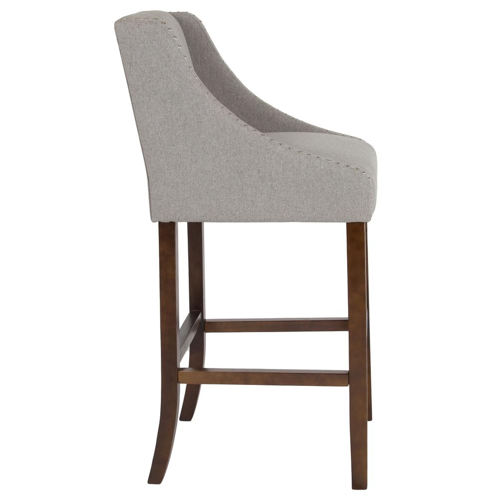 30" High Transitional Walnut Barstool with Accent Nail Trim in Light Gray Fabric. Picture 2