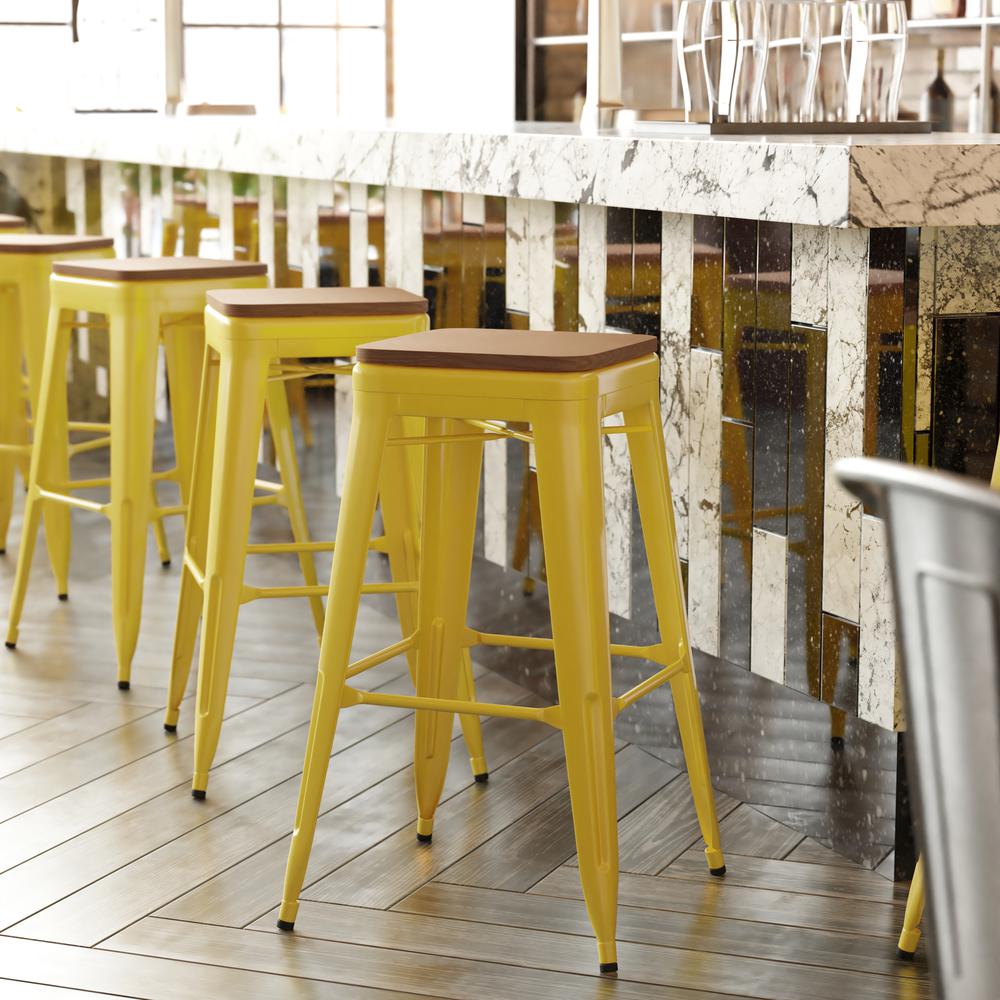 30" High Yellow Metal Indoor-Outdoor Barstool with Teak Poly Resin Wood Seat. Picture 1