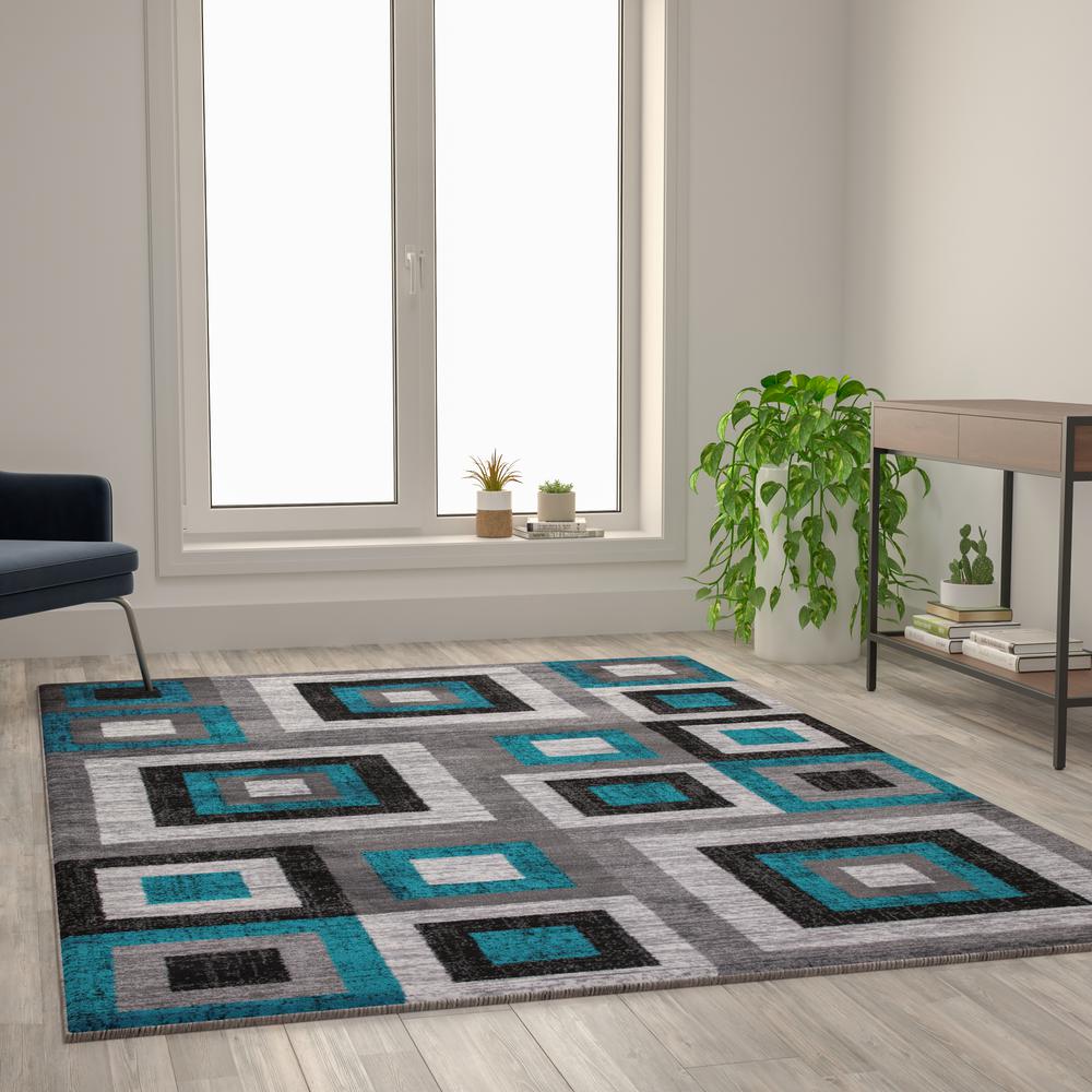 Geometric 6' x 9' Turquoise, Grey, and White Olefin Area Rug with Cotton Backing. Picture 6