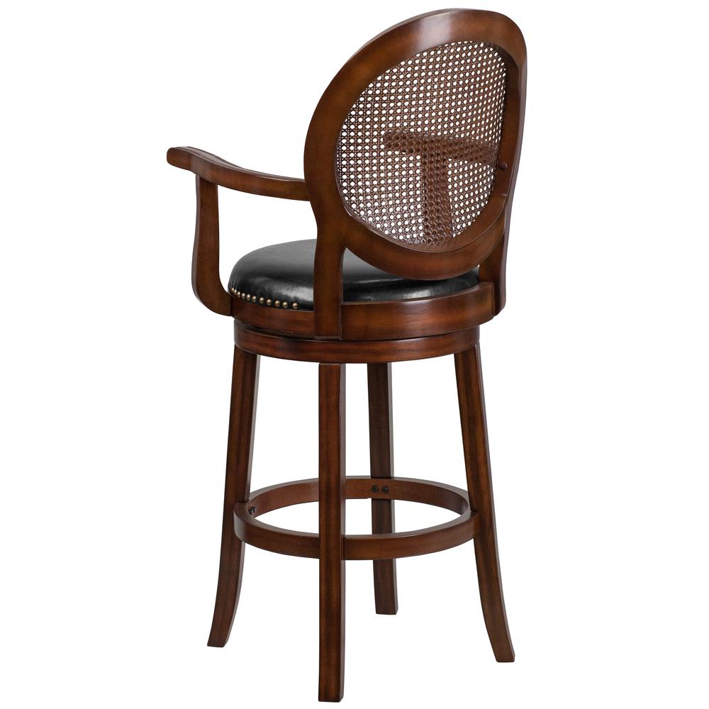 30'' High Expresso Wood Barstool with Arms, Woven Rattan Back and Black LeatherSoft Swivel Seat. Picture 3