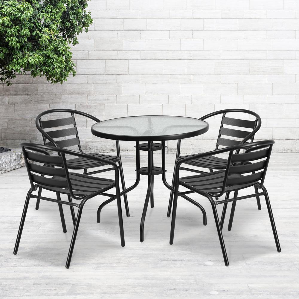 31.5'' Round Glass Metal Table with 4 Black Metal Aluminum Slat Stack Chairs. Picture 4