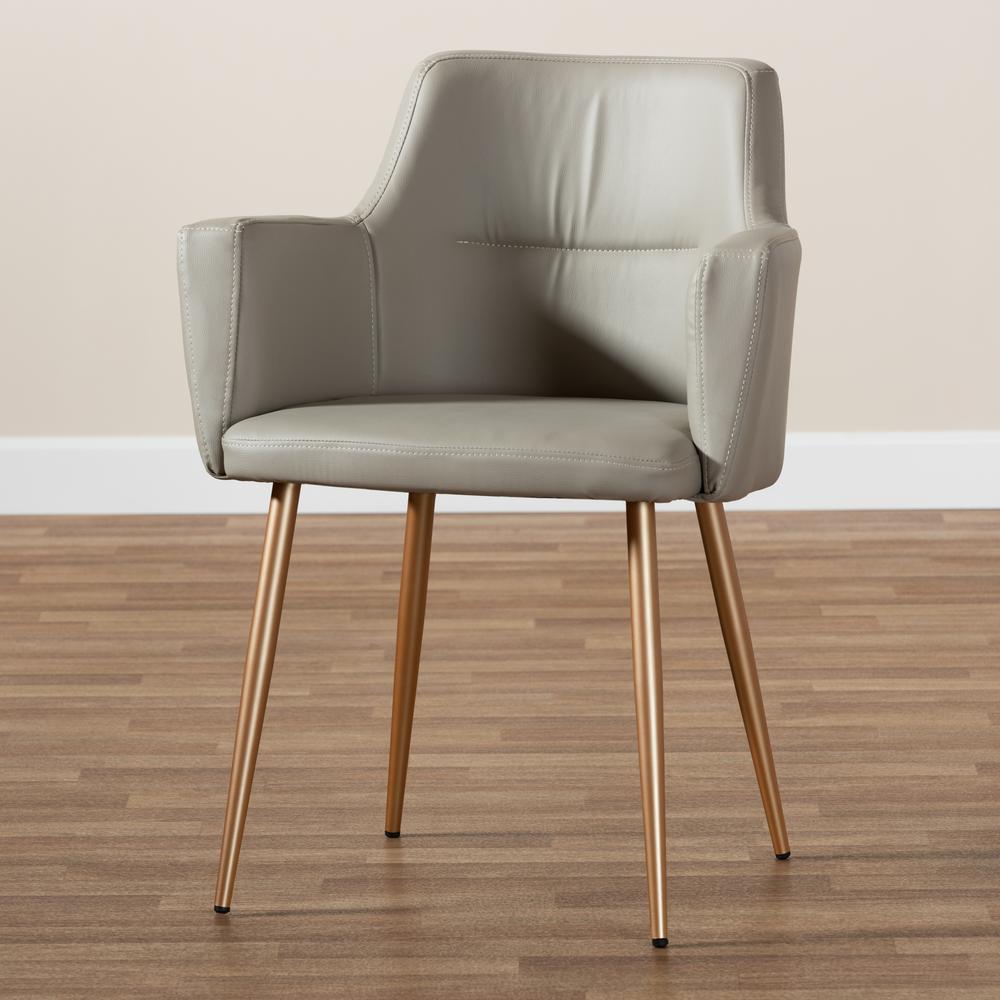 Martine Glam and Luxe Grey Faux Leather Upholstered Gold Finished Metal Dining Chair. Picture 1