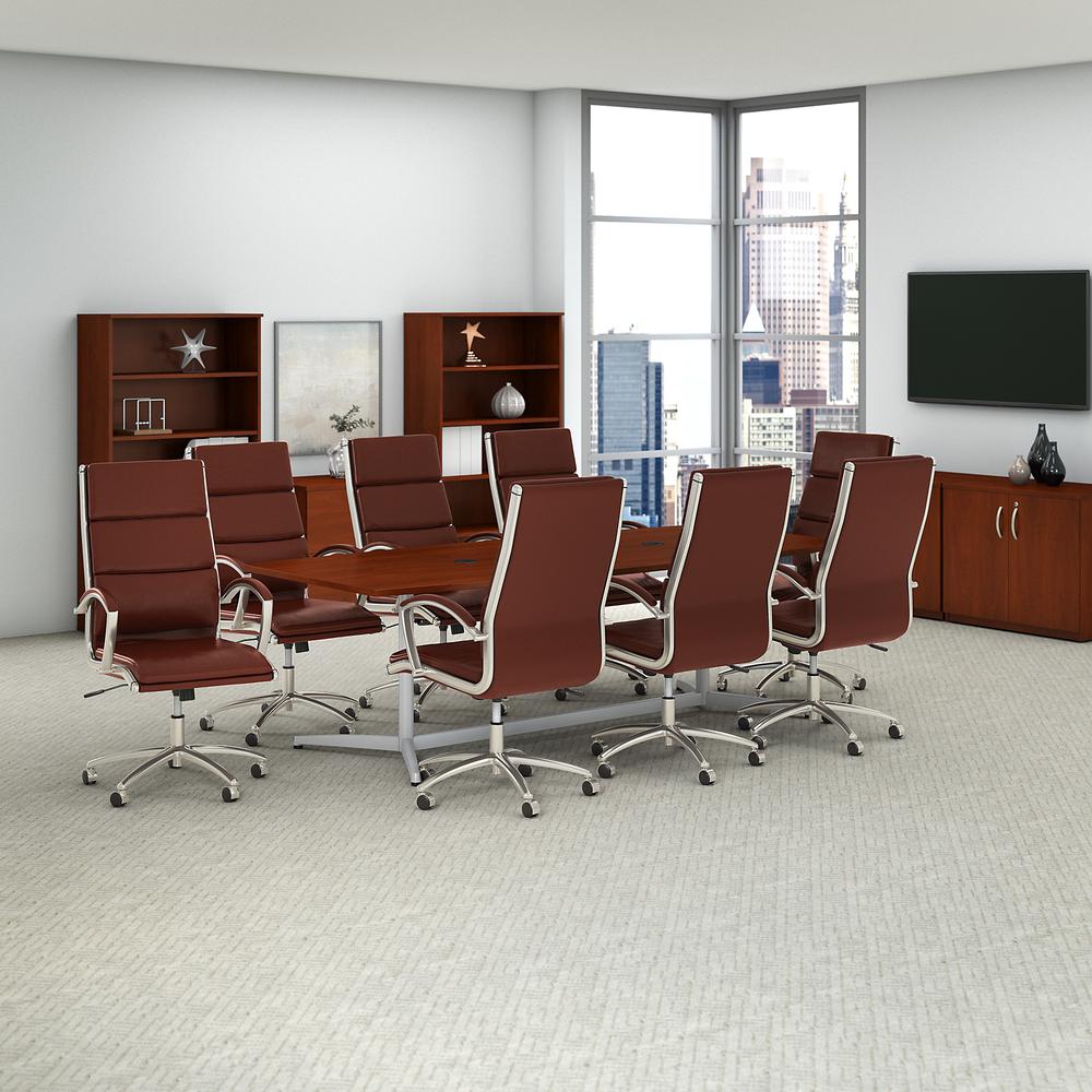 96W x 42D Boat Shaped Conference Table with Metal Base and Set of 8 High Back Office Chairs, Hansen Cherry. Picture 2