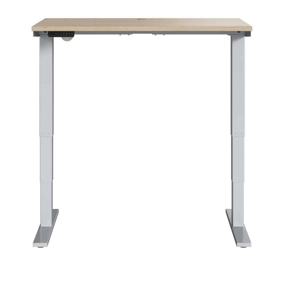 Electric Height Adjustable Standing Desk in Natural Elm with Silver Base. Picture 2