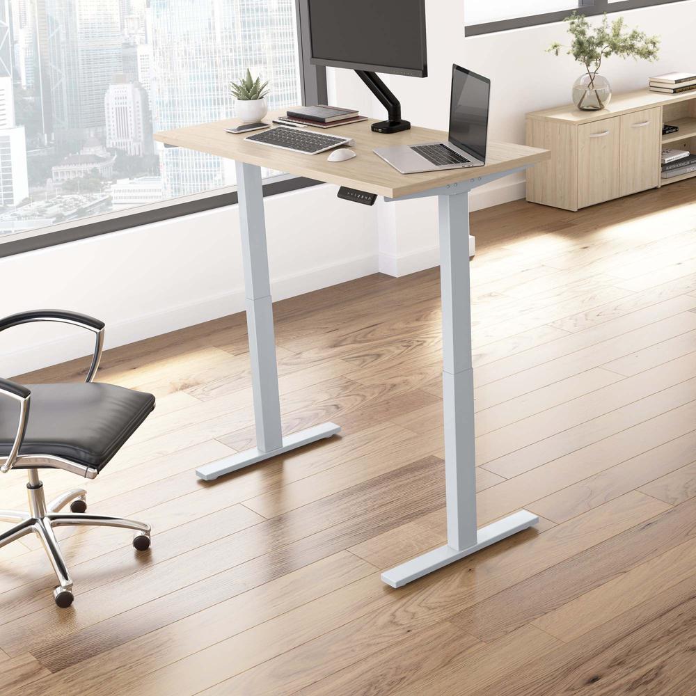 Electric Height Adjustable Standing Desk in Natural Elm with Silver Base. Picture 8