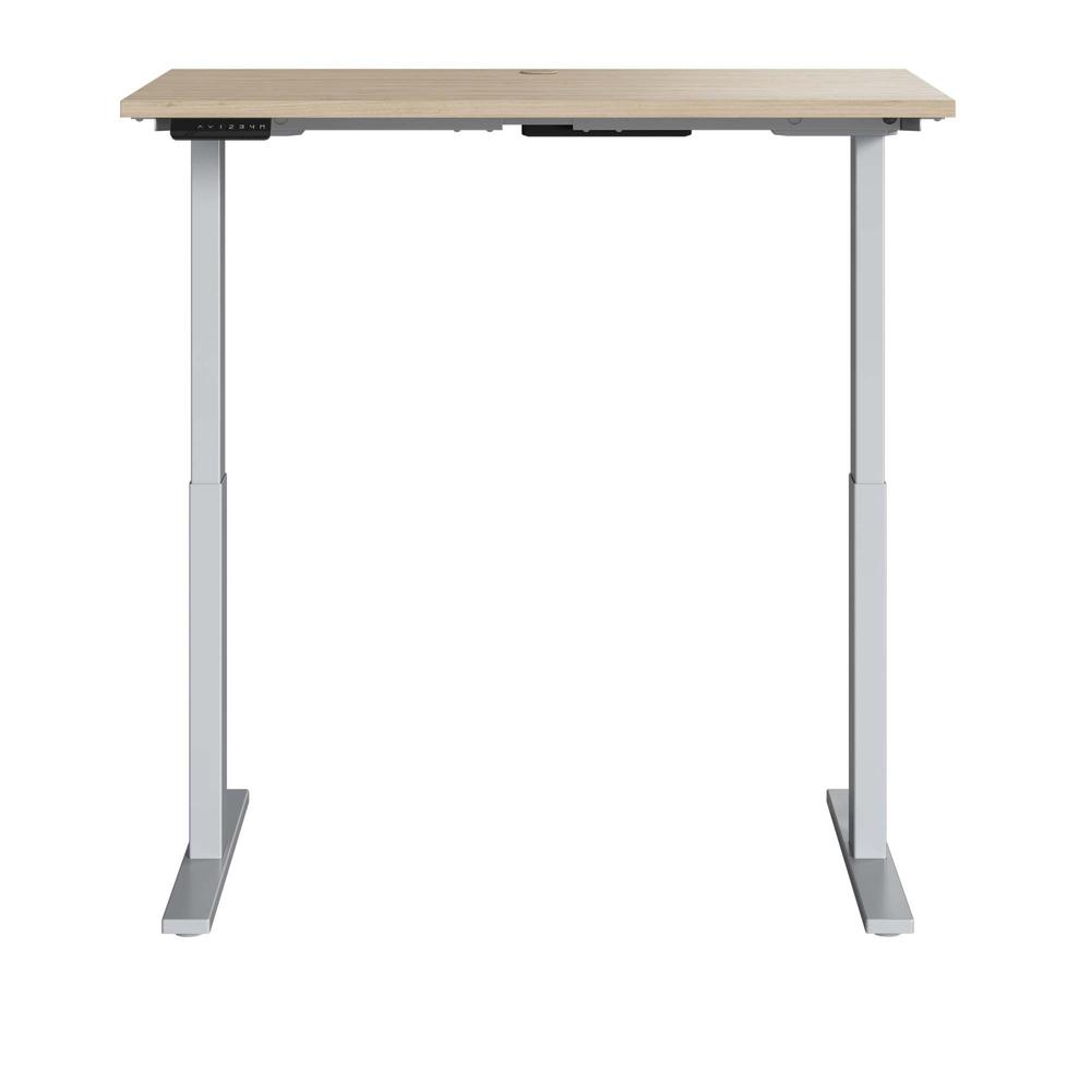 Electric Height Adjustable Standing Desk in Natural Elm with Silver Base. Picture 1