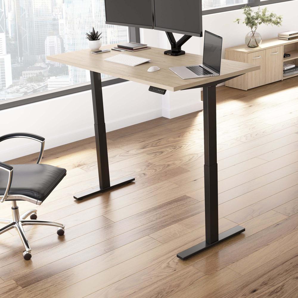Electric Height Adjustable Standing Desk in Natural Elm with Black Base. Picture 8