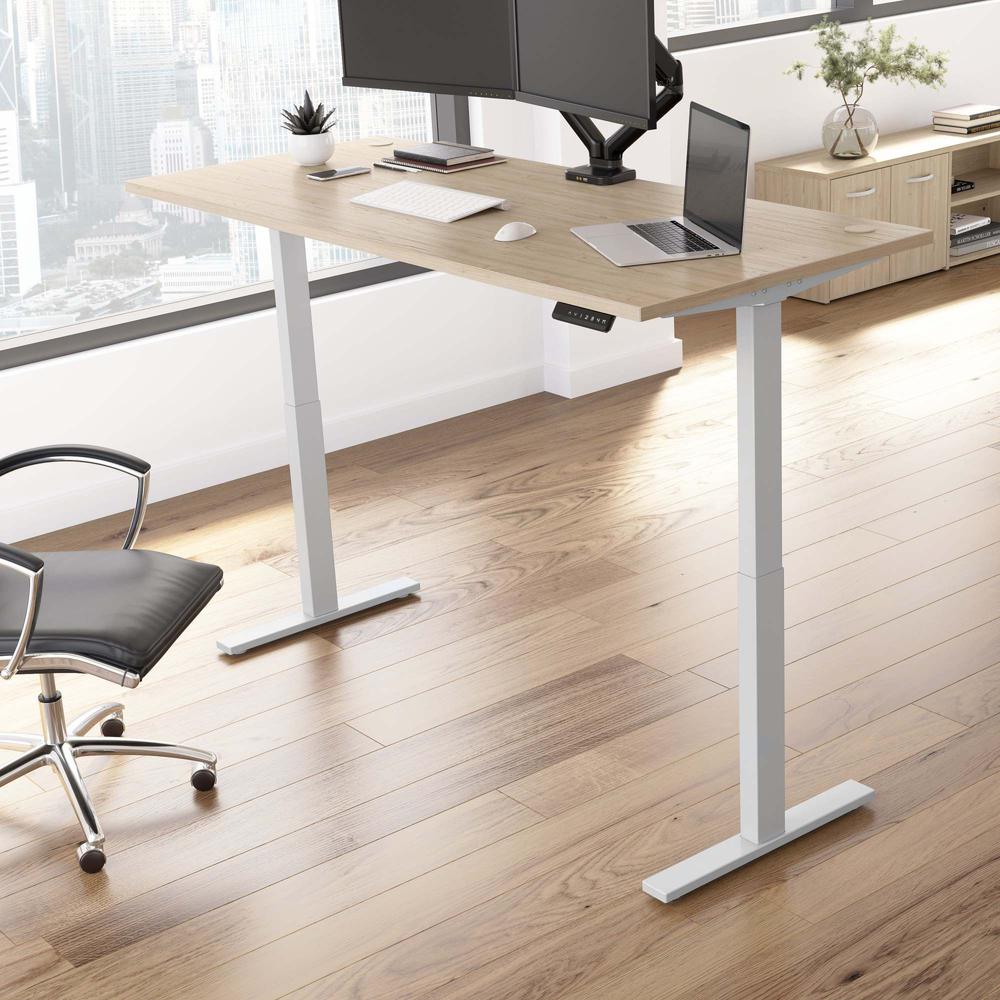 Electric Height Adjustable Standing Desk in Natural Elm with Silver Base. Picture 10