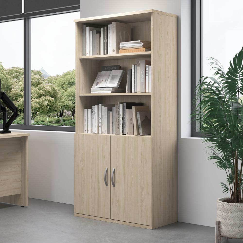 Studio C Tall 5 Shelf Bookcase with Doors in Natural Elm. Picture 8