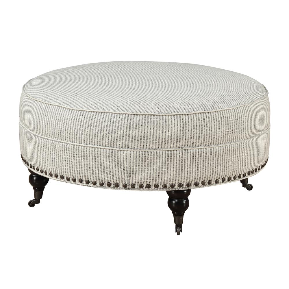 Round Ottoman with Turned Feet, Nailhead Trim, And Seam Welting. Picture 1
