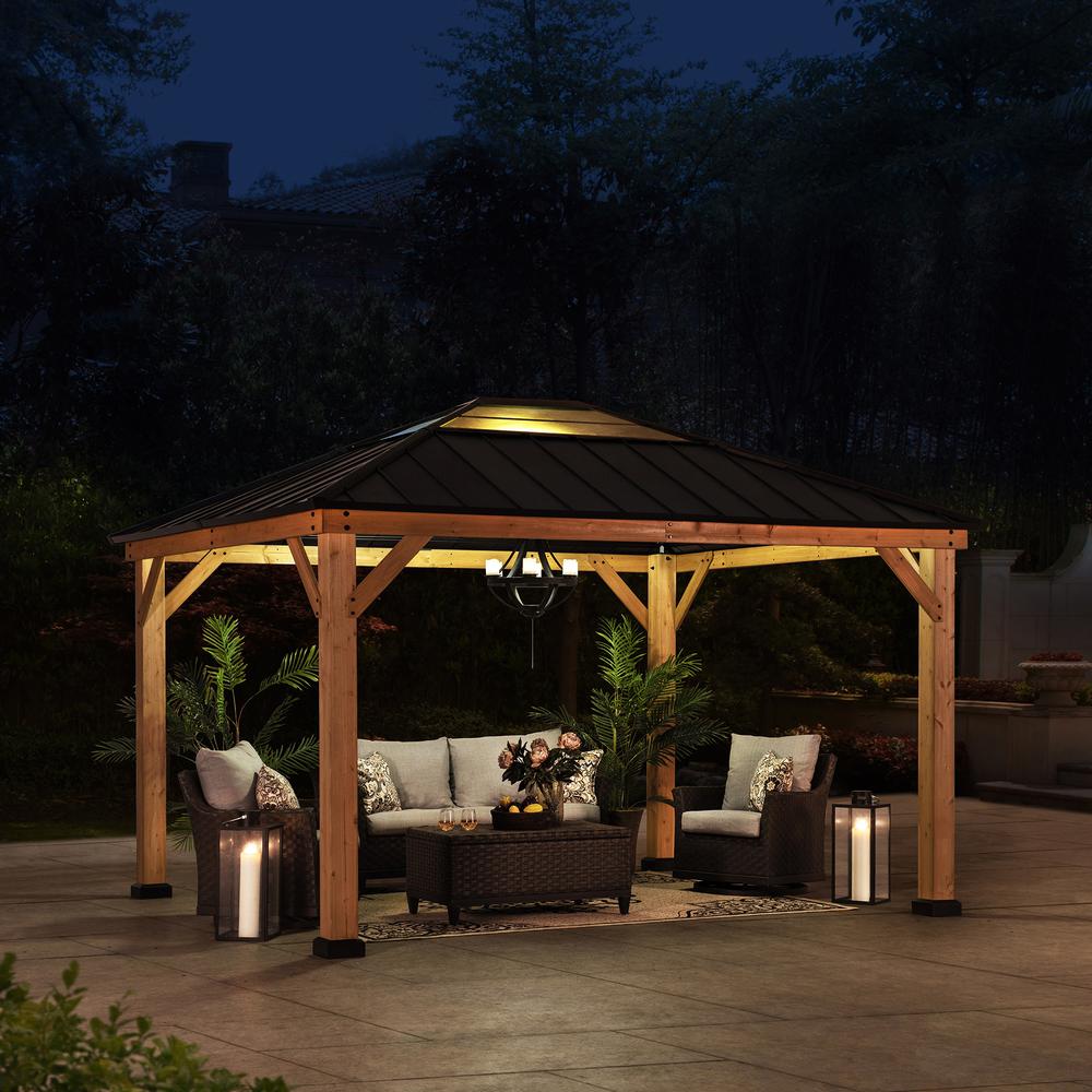 Sunjoy 11 ft. x 13 ft. Cedar Framed Gazebo with Black Steel and Polycarbonate Hip Roof Hard Top. Picture 8