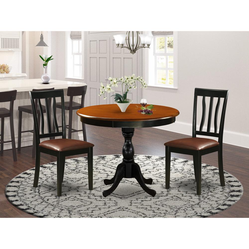 East West Furniture 3-Piece Dining Room Table Set Consists of a Modern Kitchen Table and 2 Faux Leather Kitchen Chairs with Slatted Back - Black Finish. Picture 1