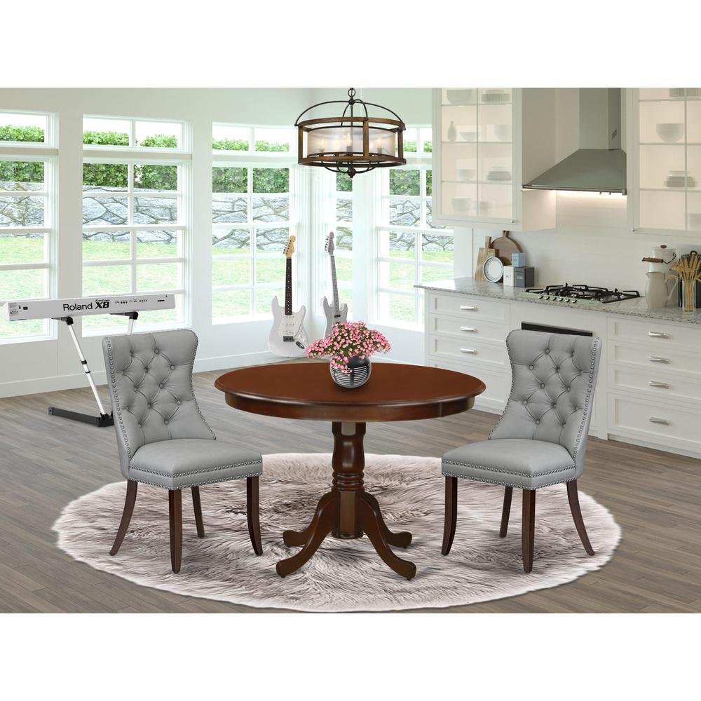 3 Piece Dining Set Consists of a Round Kitchen Table with Pedestal. Picture 1