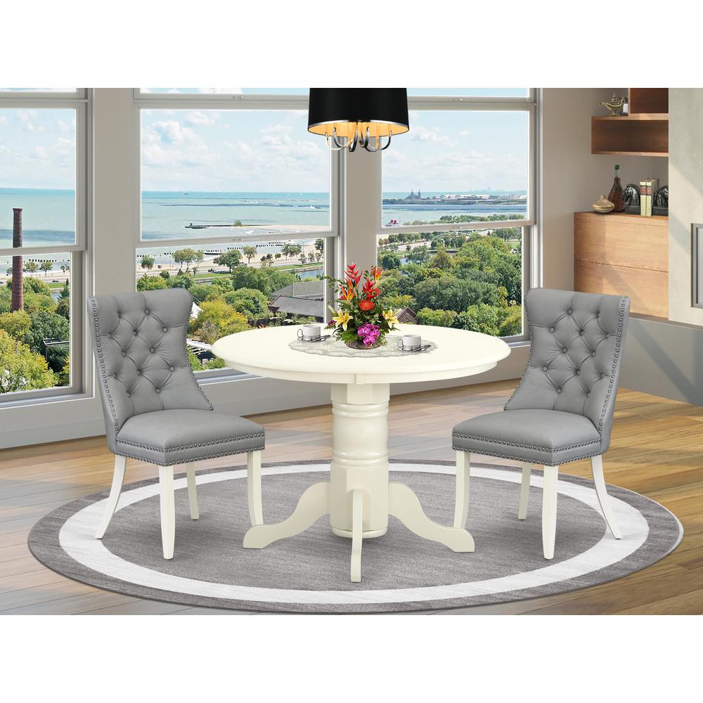 3 Piece Dinette Set Consists of a Round Kitchen Table with Pedestal. Picture 1