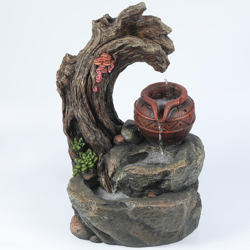 Resin Tree Stump and Rock Outdoor Fountain. Picture 1