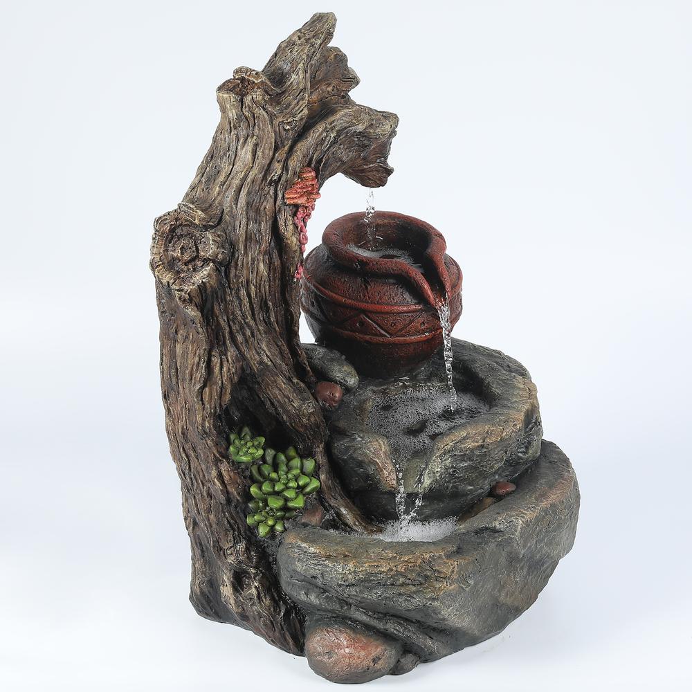 Resin Tree Stump and Rock Outdoor Fountain. Picture 7
