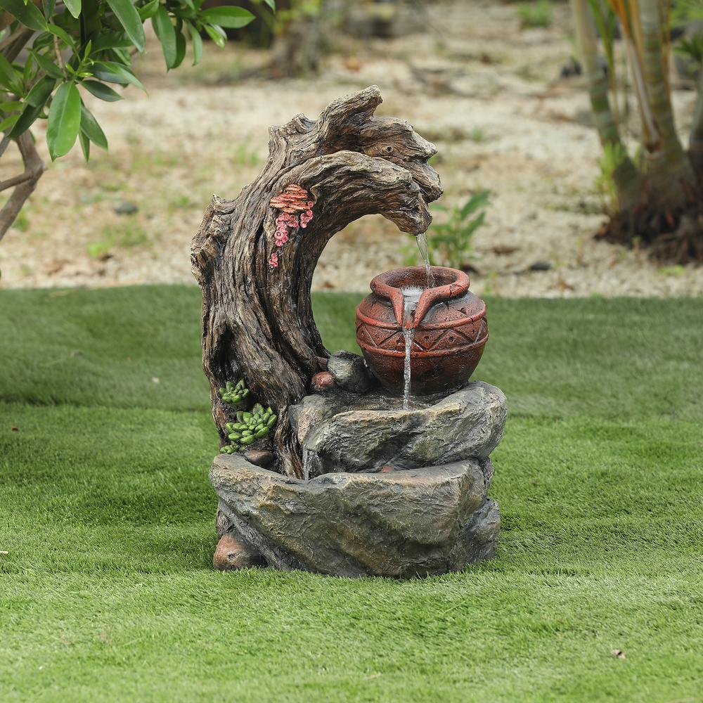 Resin Tree Stump and Rock Outdoor Fountain. Picture 2