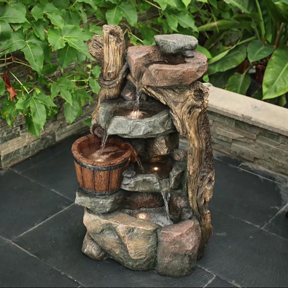 Resin Stacked Rock Wall and Barrel Outdoor Fountain with LED Lights. Picture 2