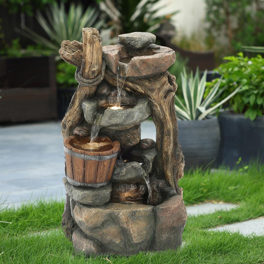 Resin Stacked Rock Wall and Barrel Outdoor Fountain with LED Lights. Picture 3