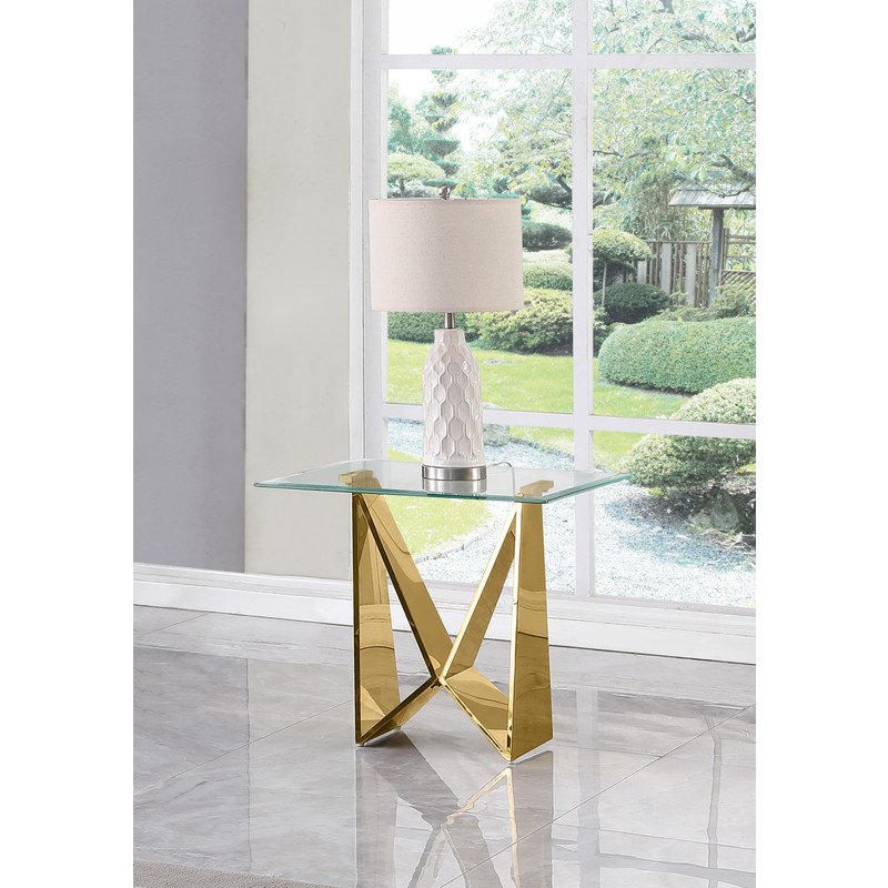 Clear glass End table with a gold color  base. Picture 2