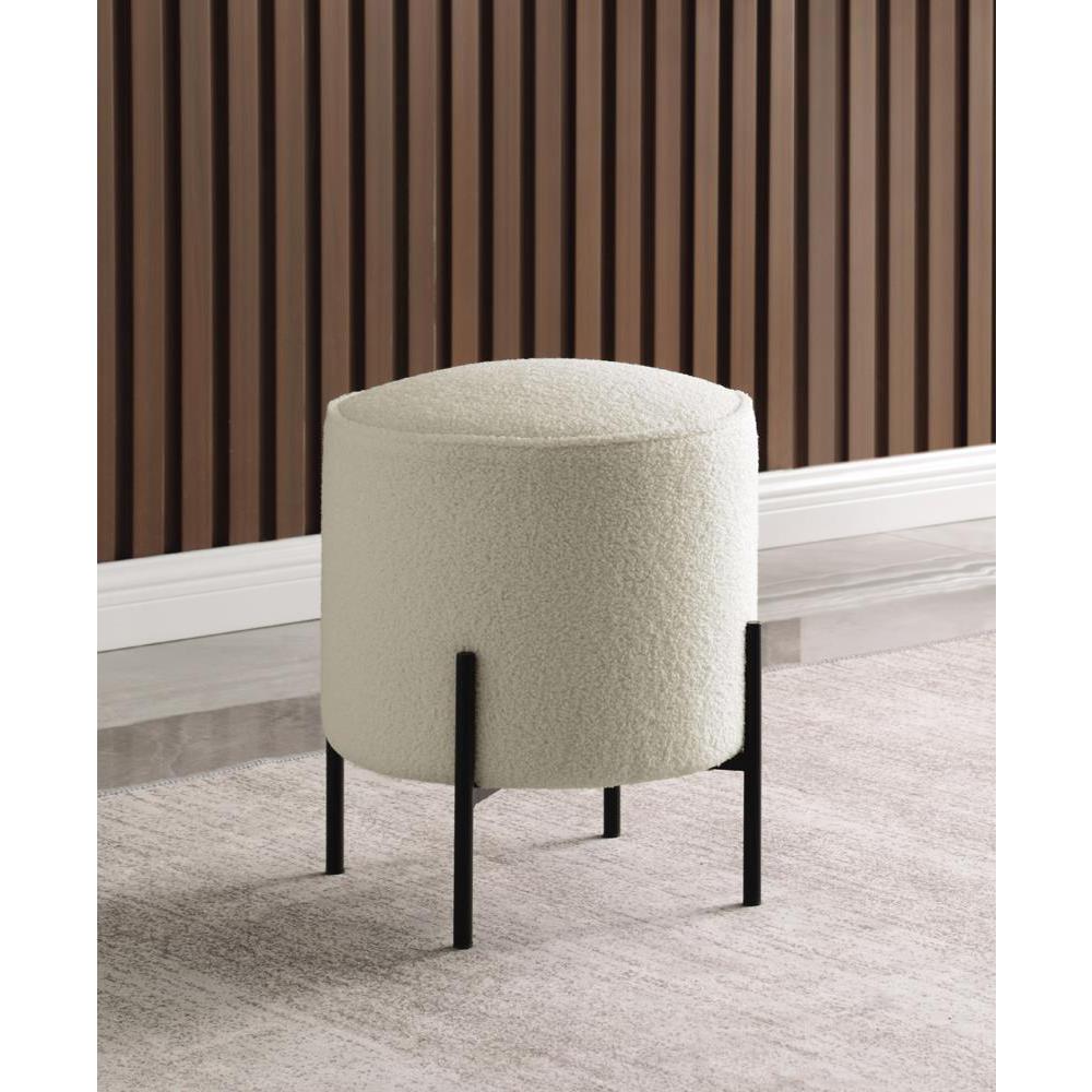 Basye Round Upholstered Ottoman Beige and Matte Black. Picture 1