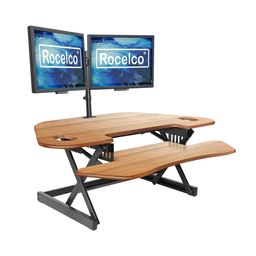 Rocelco 46" Large Height Adjustable Corner Standing Desk Converter - Quick Sit Stand Up Dual Monitor Riser - Gas Spring Assist Computer Workstation - Wide Keyboard Tray - Teak Wood Grain (R CADRT-46). Picture 1