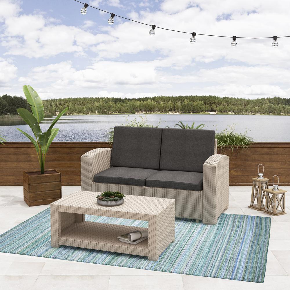 All-Weather Beige Loveseat Patio Set with Dark Grey Cushions. Picture 2