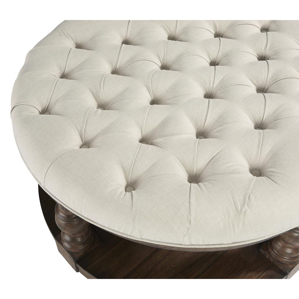 Round Upholstered Cocktail Table. Picture 1