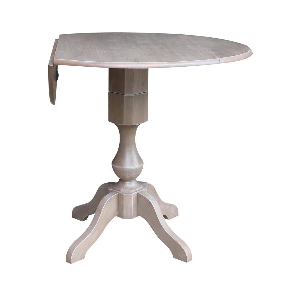 42" Round Dual Drop Leaf Pedestal Table - 36.3"H, Washed Gray Taupe. Picture 2