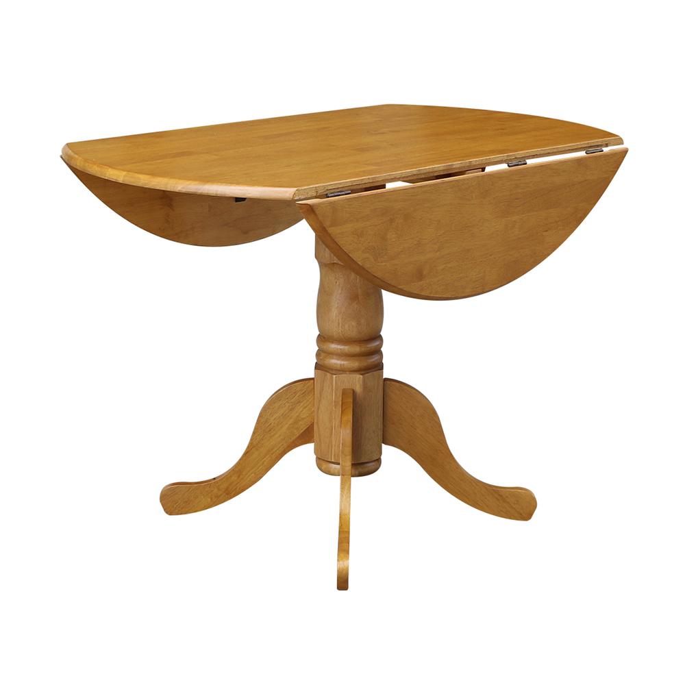 42" Round Dual Drop Leaf Pedestal Table, Oak. Picture 4