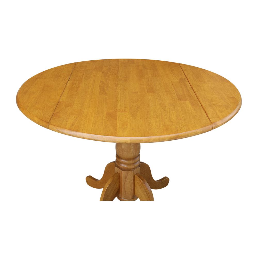42" Round Dual Drop Leaf Pedestal Table, Oak. Picture 8