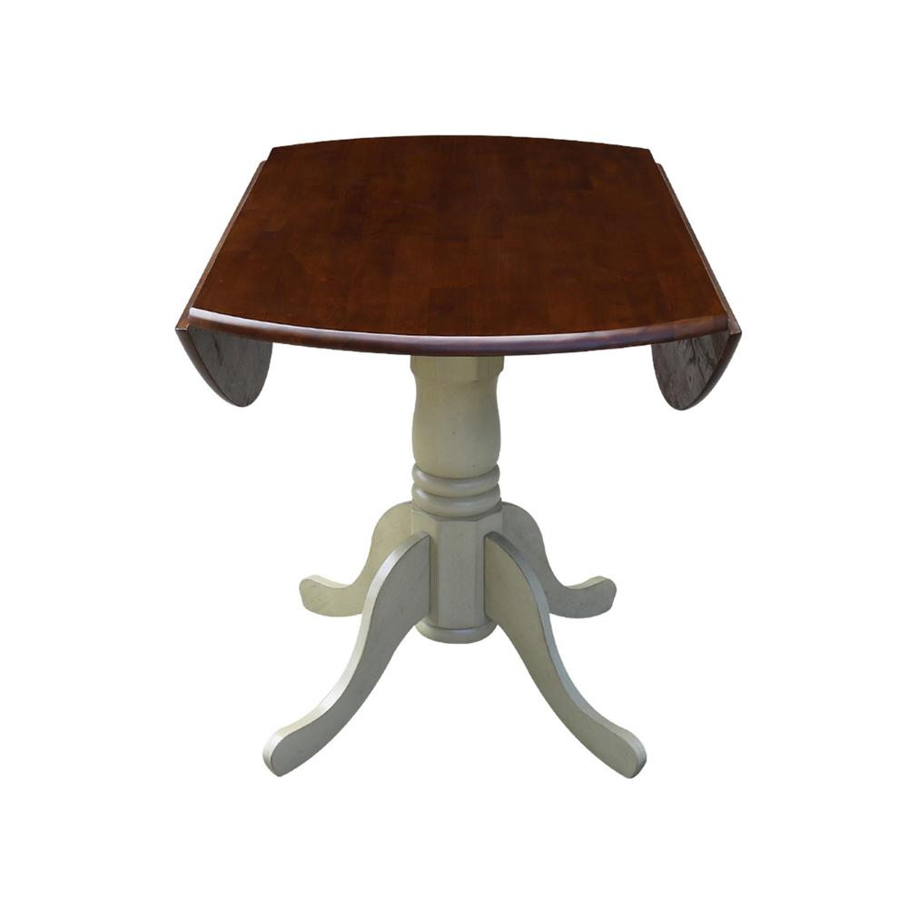 42" Round Dual Drop Leaf Pedestal Table, Antiqued Almond/Espresso. Picture 7