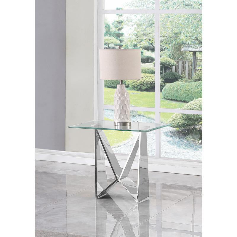 Clear glass End table with a silver color  base. Picture 2