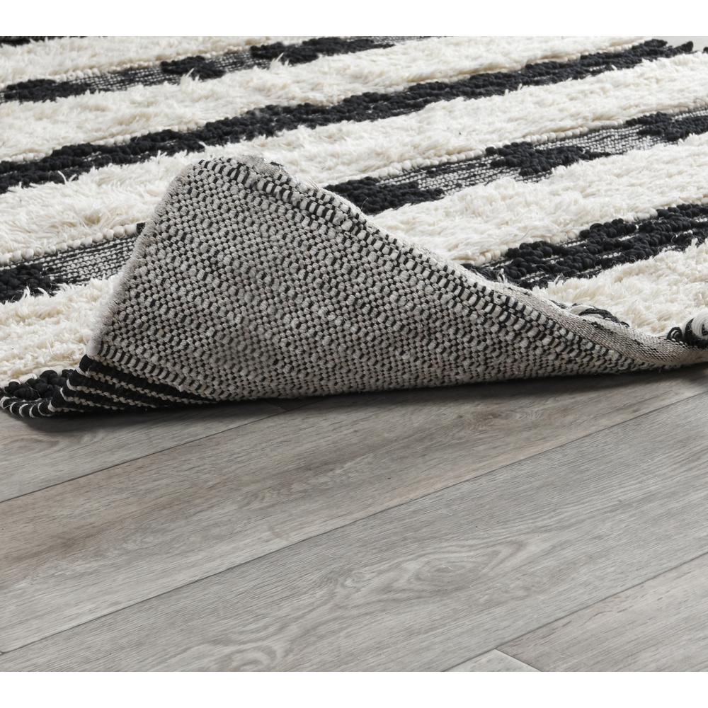 Loena Shag Black/Ivory Handwoven Area Rug by Kosas Home. Picture 3