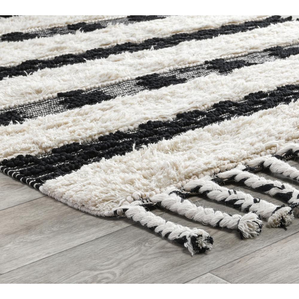Loena Shag Black/Ivory Handwoven Area Rug by Kosas Home. Picture 4