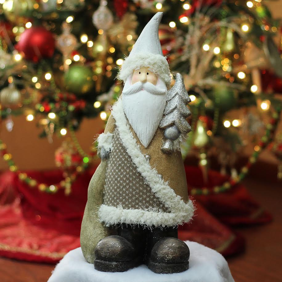 18.5" Brown and White Santa Holding Christmas Tree Tabletop Figurine. Picture 2