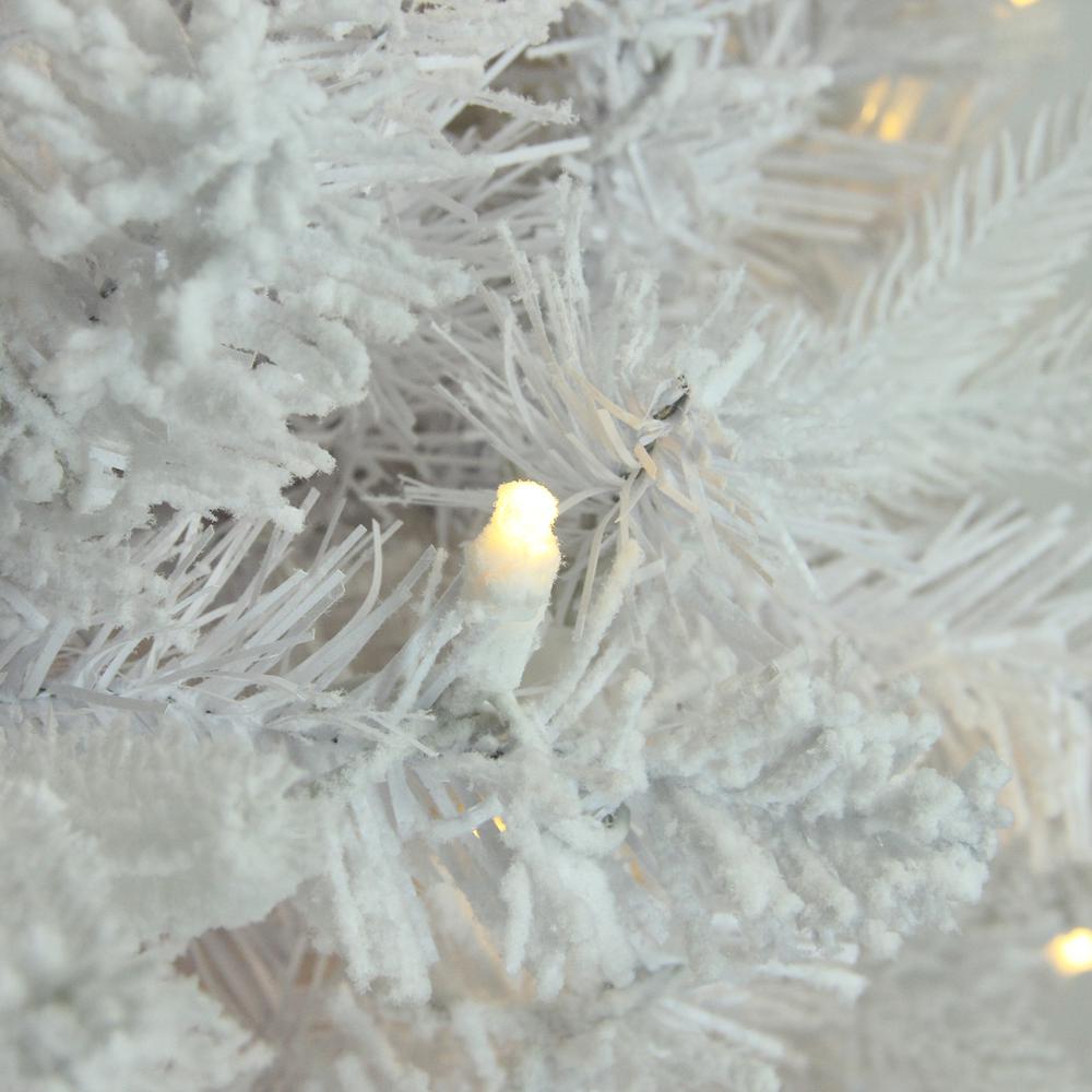 7.5' Pre-Lit Slim Flocked Pine Artificial Christmas Tree - Warm White LED Lights. Picture 2