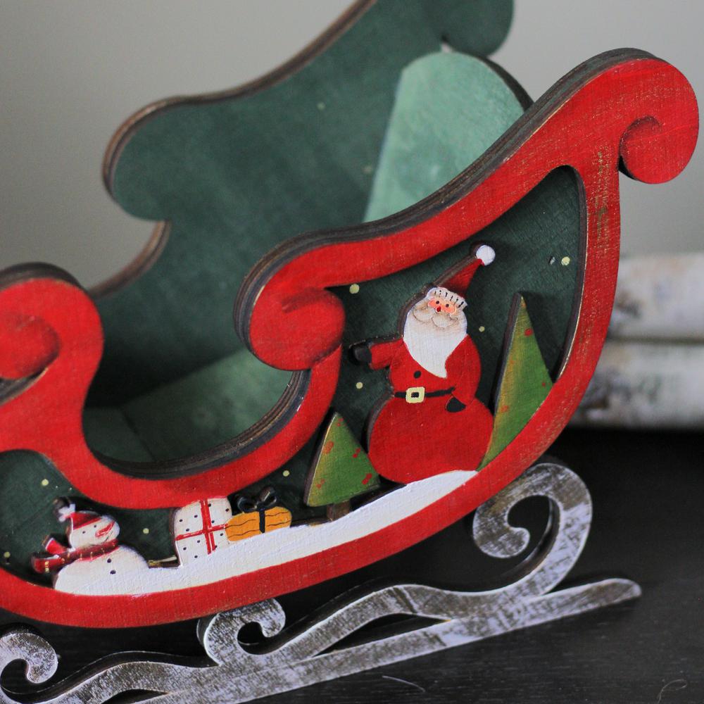 8" Red and Green Sleigh with Santa Claus and Snowman Christmas Decoration. Picture 4