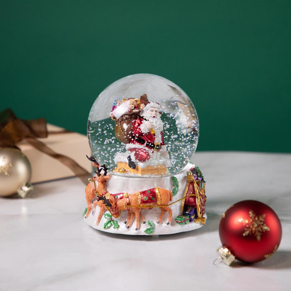6.5" Santa Delivering Gifts Musical Christmas Snow Globe. Picture 2