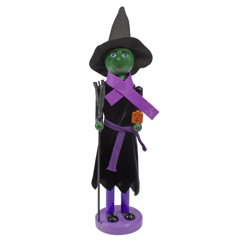 14" Black and Green Witch Jack-O-Lantern Halloween Nutcracker with Broom. Picture 1