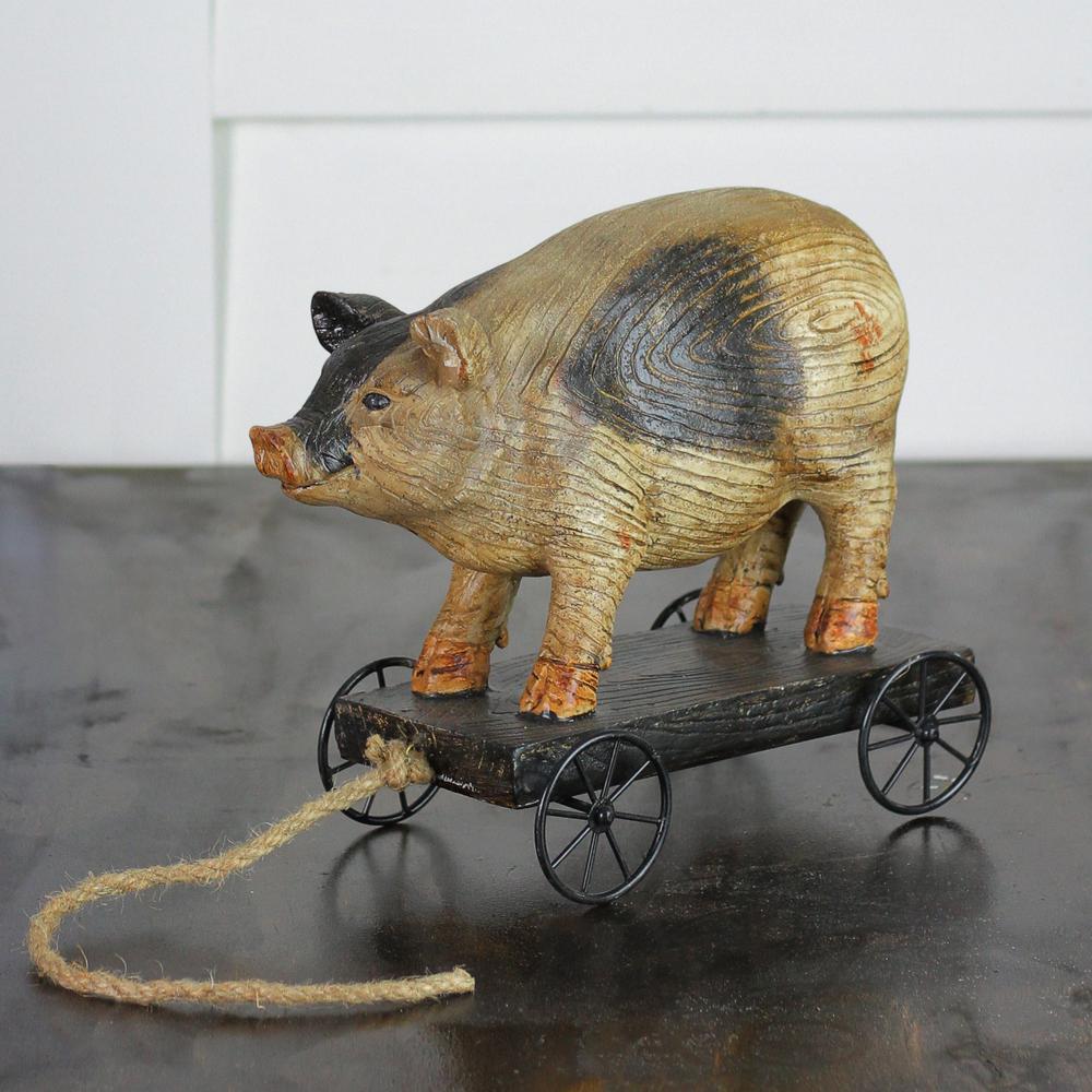 10" Black and White Wood Textured Pig on Cart Outdoor Garden Statue. Picture 3