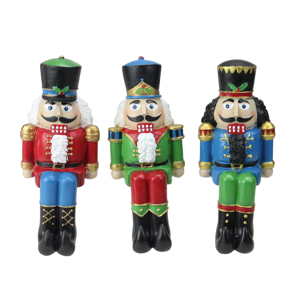 Set of 3 Red  Blue and Green Nutcracker Christmas Stocking Holders 7.5". Picture 1