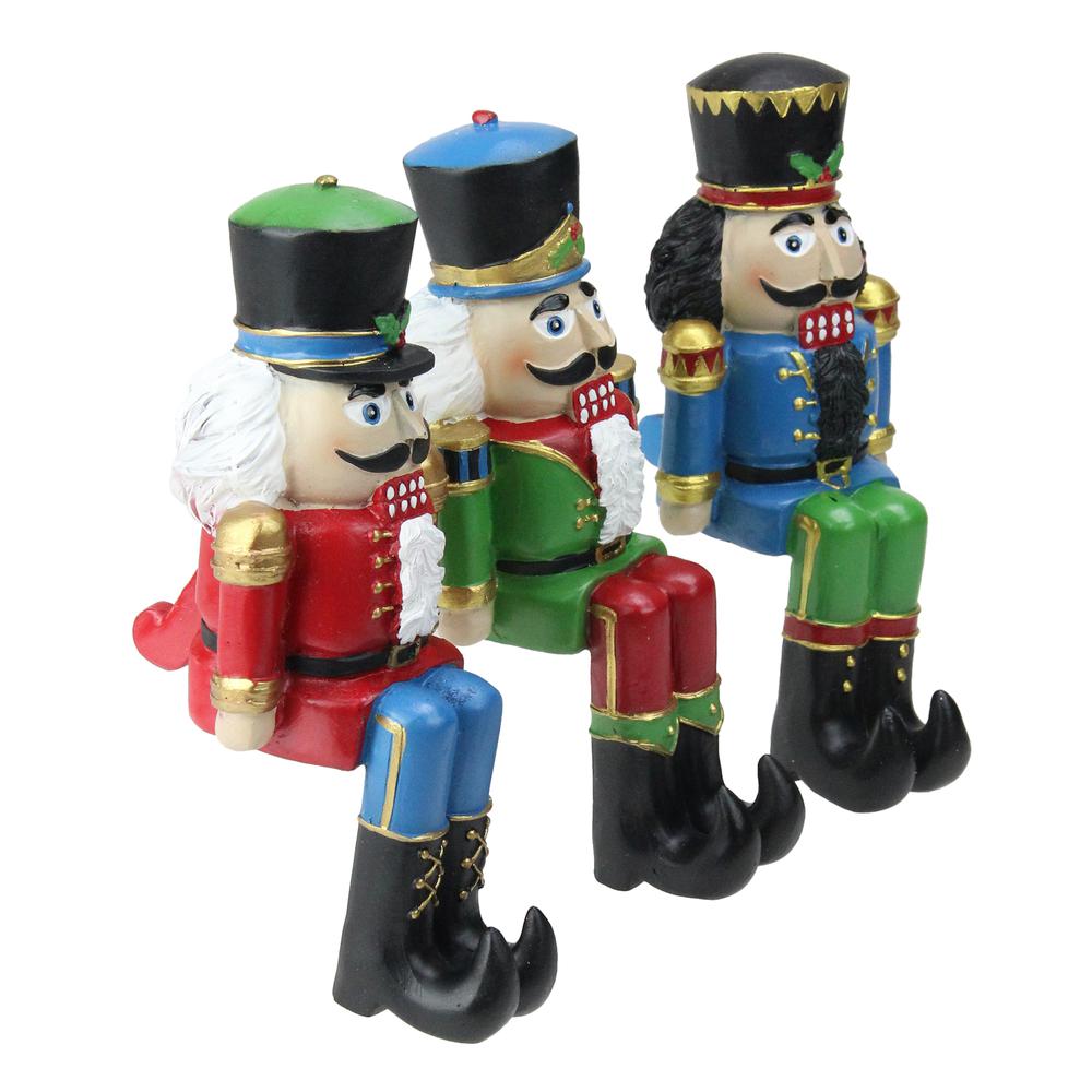 Set of 3 Red  Blue and Green Nutcracker Christmas Stocking Holders 7.5". Picture 2