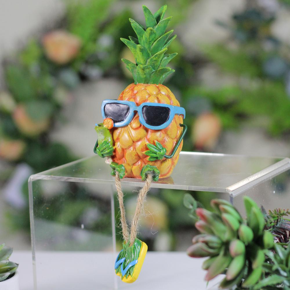10" Tropical Pineapple Boy Figure with Cocktail and Dangling Legs. Picture 3