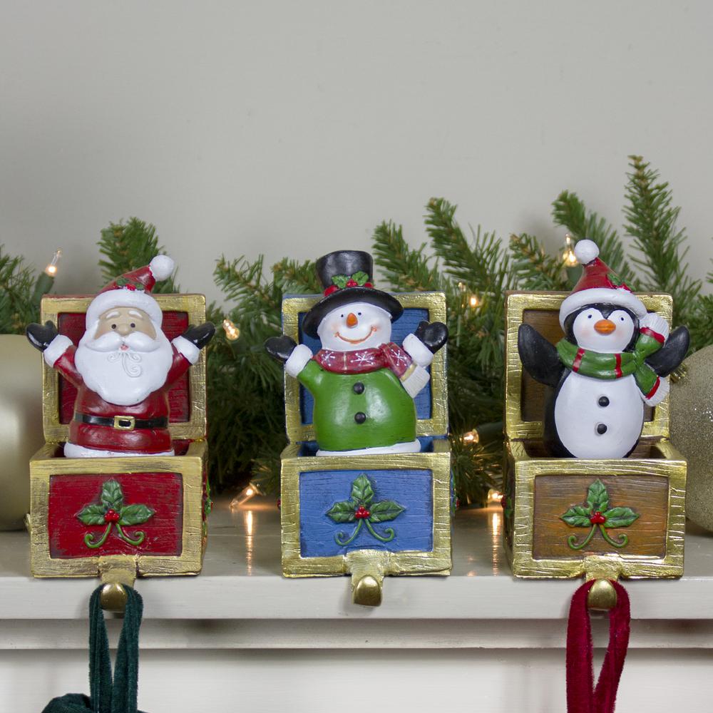 Set of 3 Santa  Snowman and Penguin Jack in the Box Christmas Stocking Holders. Picture 2